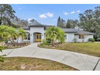 Beautiful updated home with circular driveway and lush landscaping at 1719 Finley Ave, Apopka, FL 32703