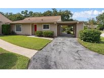 Quaint single-story home with carport and well-manicured lawn at 1934 Abbington St # 37, Apopka, FL 32712