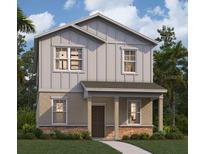 Two-story house featuring gray siding, stone accents, and a front porch at 5586 Stockade Blvd, St Cloud, FL 34771