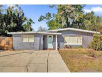 Updated exterior boasts a gray color scheme and a well-maintained front yard at 1429 Yates St, Orlando, FL 32804