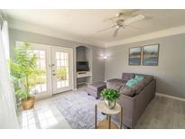 Spacious living room with sectional sofa and access to a patio at 3016 Bonfire Beach Dr # 104, Kissimmee, FL 34746