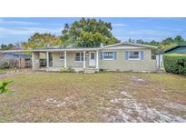 Charming single-story home with a well-maintained lawn and brick facade at 3501 Calumet Dr, Orlando, FL 32810