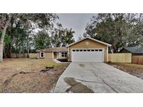 Cute newly renovated home with a large yard and driveway at 706 Old Creek Ct, Sanford, FL 32773