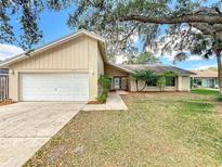 Charming one-story home featuring an attached garage and a well-manicured front yard, creating a welcoming curb appeal at 164 Morning Glory Dr, Lake Mary, FL 32746