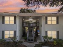 Attractive building exterior with a stairway and landscaping at 4876 Conway Rd # 96, Orlando, FL 32812