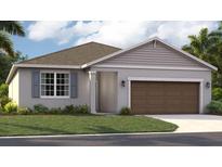 One-story home with brown garage door and gray siding at 9548 Starling Loop, Leesburg, FL 34788