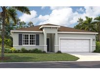 Charming single-story home features a two-car garage, well-maintained lawn, and tropical landscaping at 9552 Starling Loop, Leesburg, FL 34788