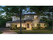 Stunning two-story home with stone accents and a beautifully landscaped yard at 11043 Cromwell Rd, Orlando, FL 32827