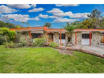 Charming mid-century home with stone facade and landscaped yard at 2808 Touraine Ave, Orlando, FL 32812
