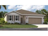 One-story home with gray siding, stone accents, and a two-car garage at 905 Pearlwood Loop, Eagle Lake, FL 33839