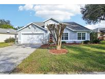 Charming single-Gathering home with well-maintained lawn and manicured landscaping at 298 Misty Meadow Dr, Ocoee, FL 34761