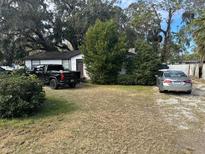 Simple one-story house with a spacious yard and driveway at 3614 Grice St, Apopka, FL 32703