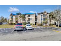 Two-story apartment building with ample parking and landscaping at 1964 Lake Atriums Cir # 175, Orlando, FL 32839