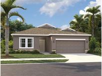 One-story home with a two-car garage and attractive landscaping at 329 Conway Ave, St Cloud, FL 34771