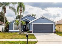 Charming single-Gathering home with well-maintained lawn and beautiful palm trees at 3452 Kayla Cir, Oviedo, FL 32765