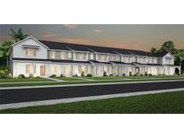 Row of inviting townhouses with light gray siding, white accents, and landscaping at 2736 Clear Night Ave, Kissimmee, FL 34744