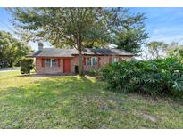 Brick ranch home with a large yard and mature trees at 328 Seminola Blvd, Casselberry, FL 32707