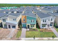 Aerial view of new construction homes with modern designs and landscaping at 4285 Prologue Way, Kissimmee, FL 34746