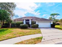 Charming single-story home with well-maintained landscaping and a two-car garage at 4001 Misty Morning Pl, Casselberry, FL 32707