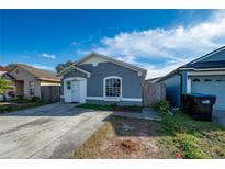 Charming single Gathering home with a long driveway and lovely curb appeal at 11148 Einbender Rd, Orlando, FL 32825