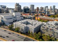 Aerial view of a condo building near a highway and city skyline at 202 E South St # 1048, Orlando, FL 32801