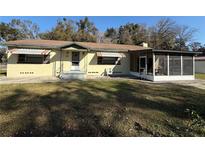 Ranch-style home with screened porch and large yard at 421 Sw 23Rd St, Ocala, FL 34471