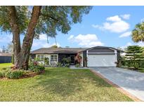 Charming single-story home featuring a lush front yard and well-maintained landscaping at 892 Breakwater Dr, Altamonte Springs, FL 32714