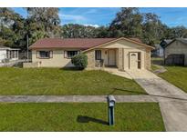 Charming single Gathering home with well-maintained lawn and appealing stone facade accents at 870 Darwin Dr, Altamonte Springs, FL 32701