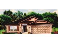 One-story house with a two-car garage and landscaping at 115 Newham Way, Kissimmee, FL 34758