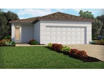 One-story home with a two-car garage and attractive landscaping at 4035 Copperleaf Ln, Poinciana, FL 34759