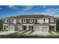 Three-unit townhome building, light beige and dark gray, with three-car garage at 2496 Penguin Blvd, Davenport, FL 33837