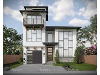 Modern two-story home with a gray garage door and balcony at 6815 Engram Rd, New Smyrna Beach, FL 32169