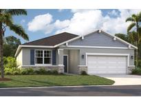 Charming single-Gathering home with gray siding, stone accents, a two-car garage, and a manicured front lawn at 1204 White Ash Loop, Deland, FL 32720