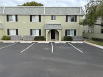 Two-story condo building with private parking and well-maintained landscaping at 525 Conway Rd # S, Orlando, FL 32807