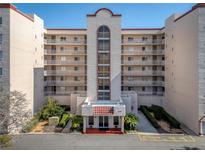 Attractive multi-story condominium with balconies and manicured landscaping at entrance at 1150 Carmel Cir # 503, Casselberry, FL 32707