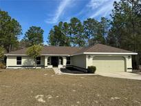 Charming single-story home with attached two-car garage and well-manicured front yard at 8315 Sw 135Th Street Rd, Ocala, FL 34473