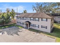 Two-story building featuring a spacious parking lot and traditional architecture at 640 Robinhood Dr # B, Maitland, FL 32751