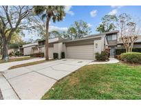 Charming townhome with attached garage, inviting walkway, and well-maintained landscaping at 95 Carolwood Blvd, Fern Park, FL 32730