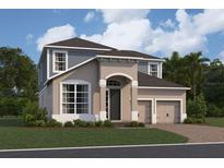 Two-story home featuring a two-car garage, neutral stucco and light blue siding with an arched front porch at 16863 Muskgrass Dr, Winter Garden, FL 34787