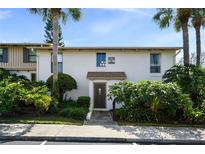 Inviting condo exterior with lush landscaping, palm trees, and a private entrance at 200 Maitland Ave # 96, Altamonte Springs, FL 32701
