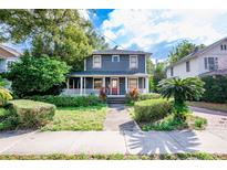Charming two-story home with a well-maintained front yard and inviting porch at 520 E Anderson St, Orlando, FL 32801