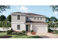 Charming two-story home with a light gray exterior, well-manicured lawn, and beautiful landscaping at 1779 Columbus Path, St Cloud, FL 34771