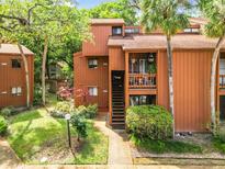 Charming two-story condo with well-maintained landscaping and inviting entryway at 976 E Michigan St # A, Orlando, FL 32806