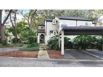 Charming home featuring a covered carport and landscaped front yard, creating an inviting curb appeal at 1567 Farrindon Cir # 1567, Lake Mary, FL 32746