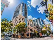 Modern architecture meets vibrant city life in this impressive downtown street view at 155 S Court Ave # 2904-Penthouse, Orlando, FL 32801