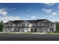 New townhomes boasting neutral toned siding, individual garages and manicured landscaping at 395 Sequoia Dr, Lake Wales, FL 33859