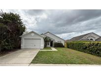 Charming single-Gathering home featuring a well-maintained lawn and attached two-car garage at 458 Lancers Dr, Winter Springs, FL 32708