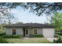 Charming single-story home featuring a well-maintained lawn and a classic architectural design at 38934 Merrell Ave, Umatilla, FL 32784