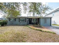 Charming single-story home featuring well-kept landscaping and a welcoming entrance, situated on a sunny lot at 3624 Chelsea St, Orlando, FL 32803