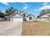 Charming single-story home featuring a two-car garage and well-maintained landscaping at 9307 Echo Run, Orlando, FL 32817